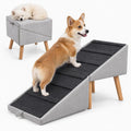 Foldable dog ramp ottoman with hidden storage beside a couch