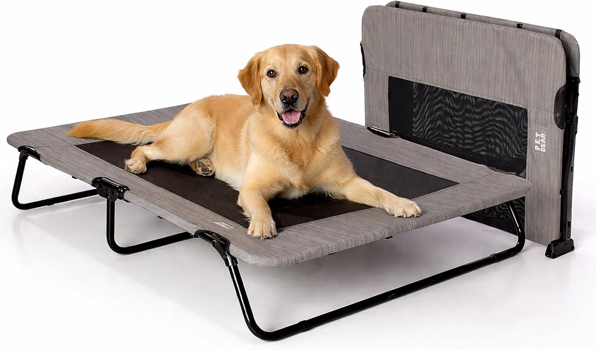 Sand colored elevated pet cot with mesh surface on a patio
