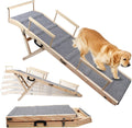 Gray solid wood folding dog ramp with carpet and guardrails leading to a bed
