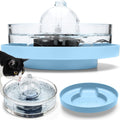 Glass cat water fountain sitting on a blue raised stand