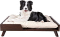 Dark brown mid-century wooden elevated dog bed with neutral cushion