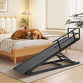 Adjustable wooden dog ramp leaning against a couch