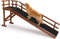Wooden dog ramp with side rails and top platform leading to a high bed