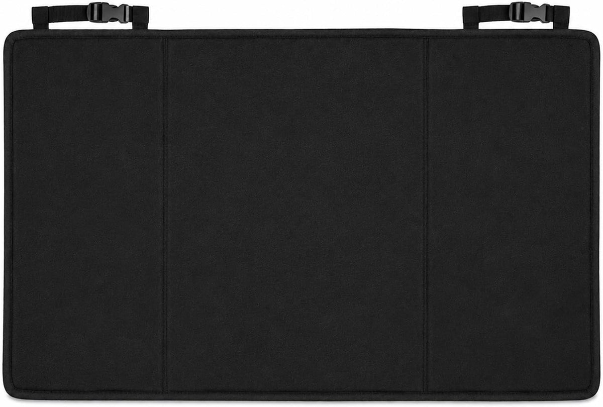 Black dog car seat cover bridging the gap between second row bucket seats