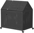 Black heavy-duty steel dog crate with pointed roof and wheels