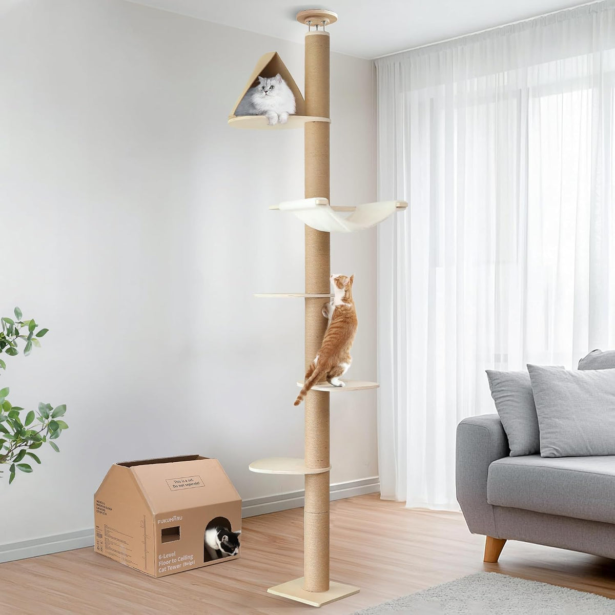 Beige floor to ceiling cat tree with hammock and scratching posts