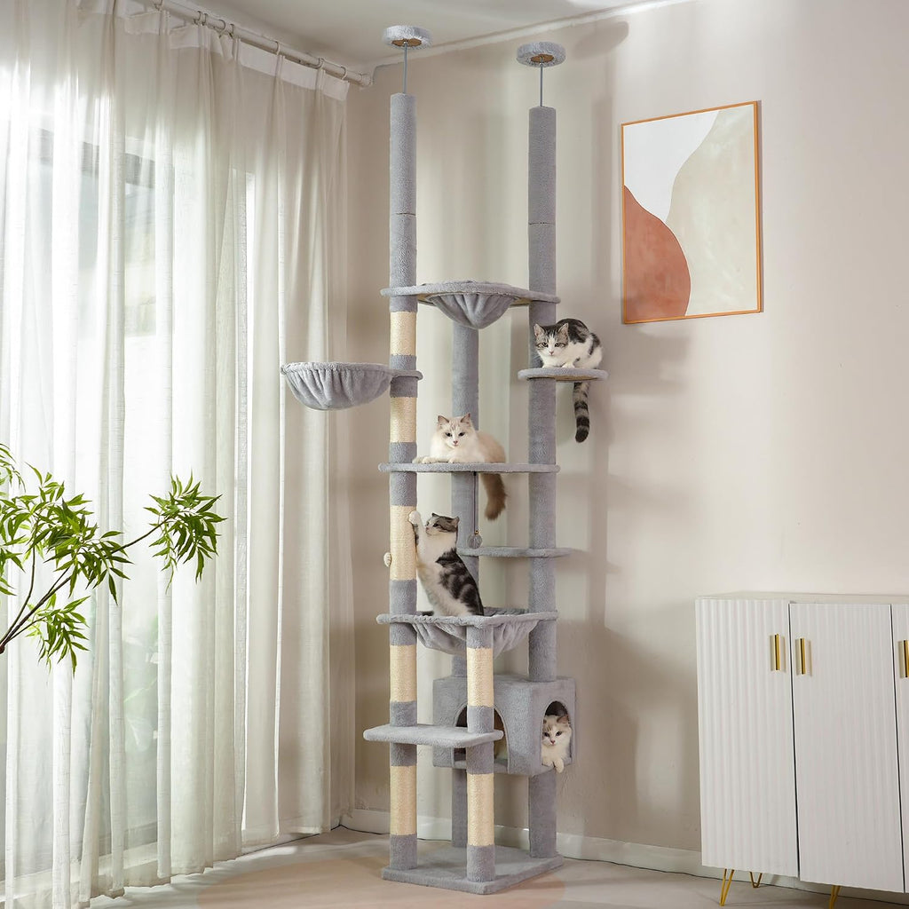 Floor to ceiling dual post cat tree with hammocks and condo in a corner – view 2