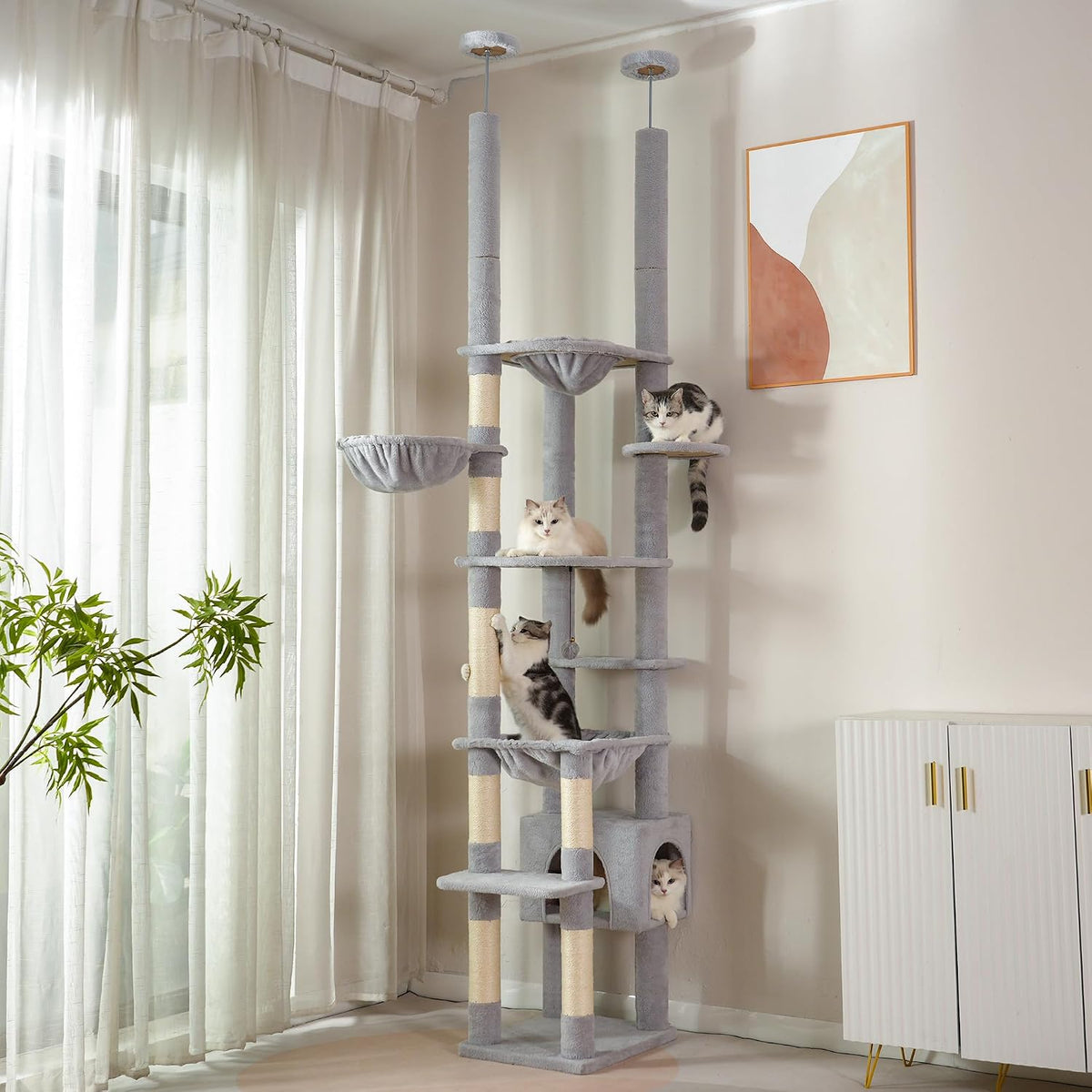 Floor to ceiling dual post cat tree with hammocks and condo in a corner – view 2