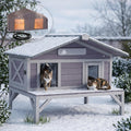 Gray porch-style heated outdoor cat house with balcony