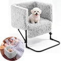 Plush bedside dog bed with bolsters attached next to a mattress