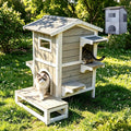 Two-story wooden outdoor cat house with balcony, platforms and four doors
