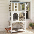 Gray wooden outdoor catio on wheels with platforms and clear capsule bed