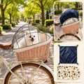 Brown woven willow dog bike basket with canopy mounted on a rear rack