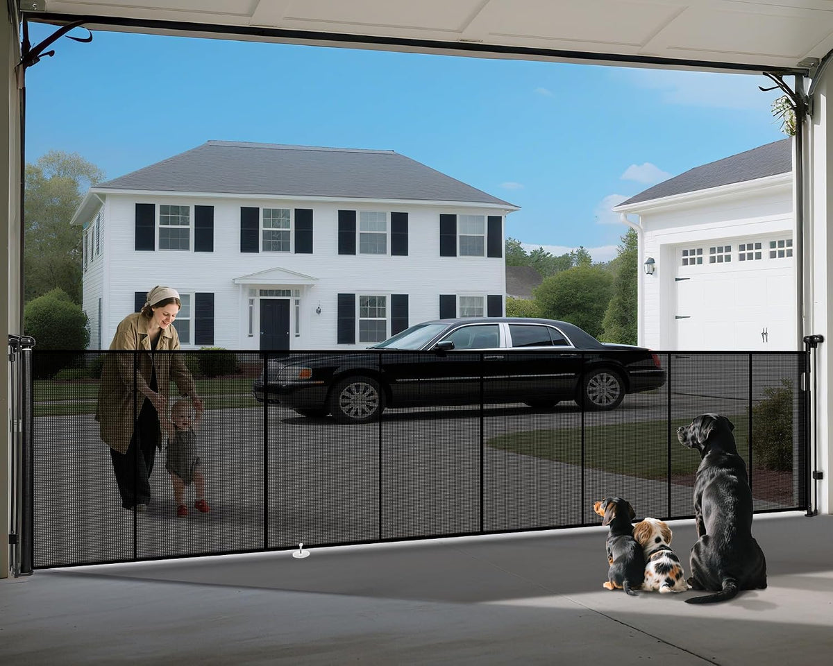 Black retractable mesh dog gate stretched across a wide patio opening
