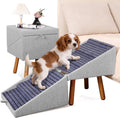 Wooden dog stairs beside a high bed doubling as a nightstand