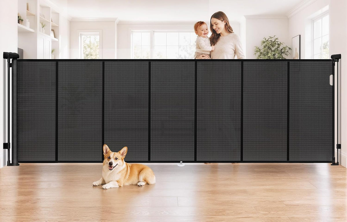 Black extra wide retractable mesh gate across a garage opening
