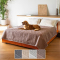 Soft taupe waterproof blanket covering a bed with a dog lying on it