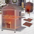 Two-story wooden outdoor cat house with dark asphalt roof and insulated interior