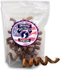 Pile of curly spiral beef bully stick chews