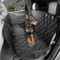 Black waterproof rear seat hammock cover for dogs in a car