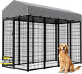 Gray outdoor metal dog kennel run with a roof cover in a backyard – view 2