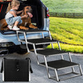 Foldable 4-step aluminum dog stairs with non-slip rug treads against an SUV – view 2