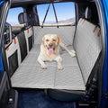 Grey leather hard-bottom dog seat extender in a truck back seat
