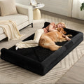 Black human size dog bed with supportive foam and zip-off cover