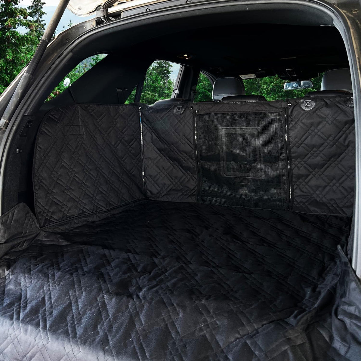 Black waterproof cargo liner with mesh window in an SUV trunk – view 2