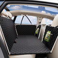 Back seat extender dog car seat cover with hard bottom installed in a car