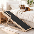 Adjustable dog ramp with non-slip surface leaning against a couch