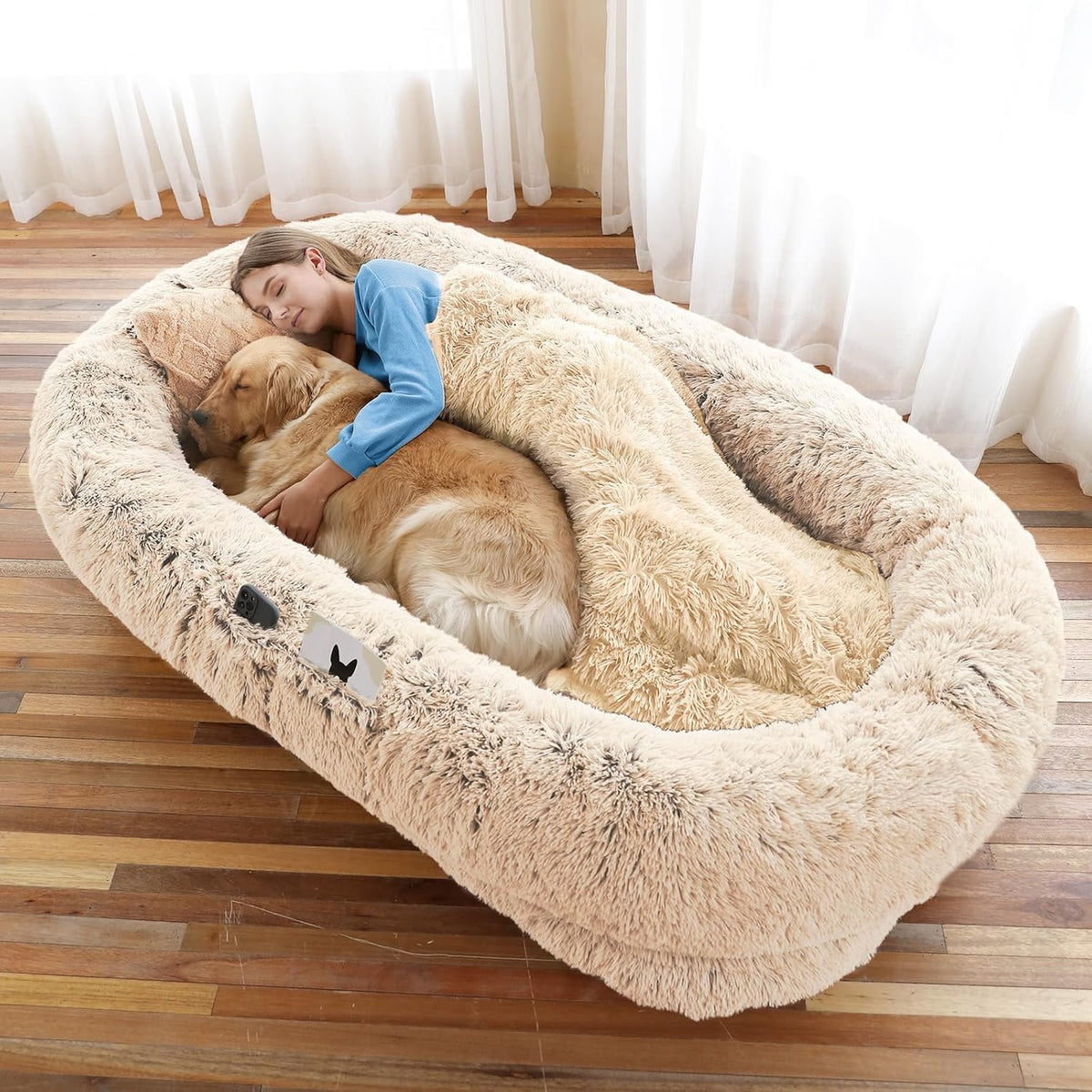 Beige large human dog bed with faux fur cover and pillow