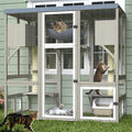 Walk-in wooden outdoor catio with platforms, hammock and roof cover