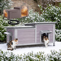 Wooden heated outdoor cat house with insulated liner