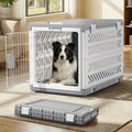 Gray collapsible fabric travel dog crate with two wheels