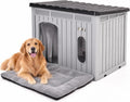 Large plastic dog house with sloped roof, door curtain and vent window
