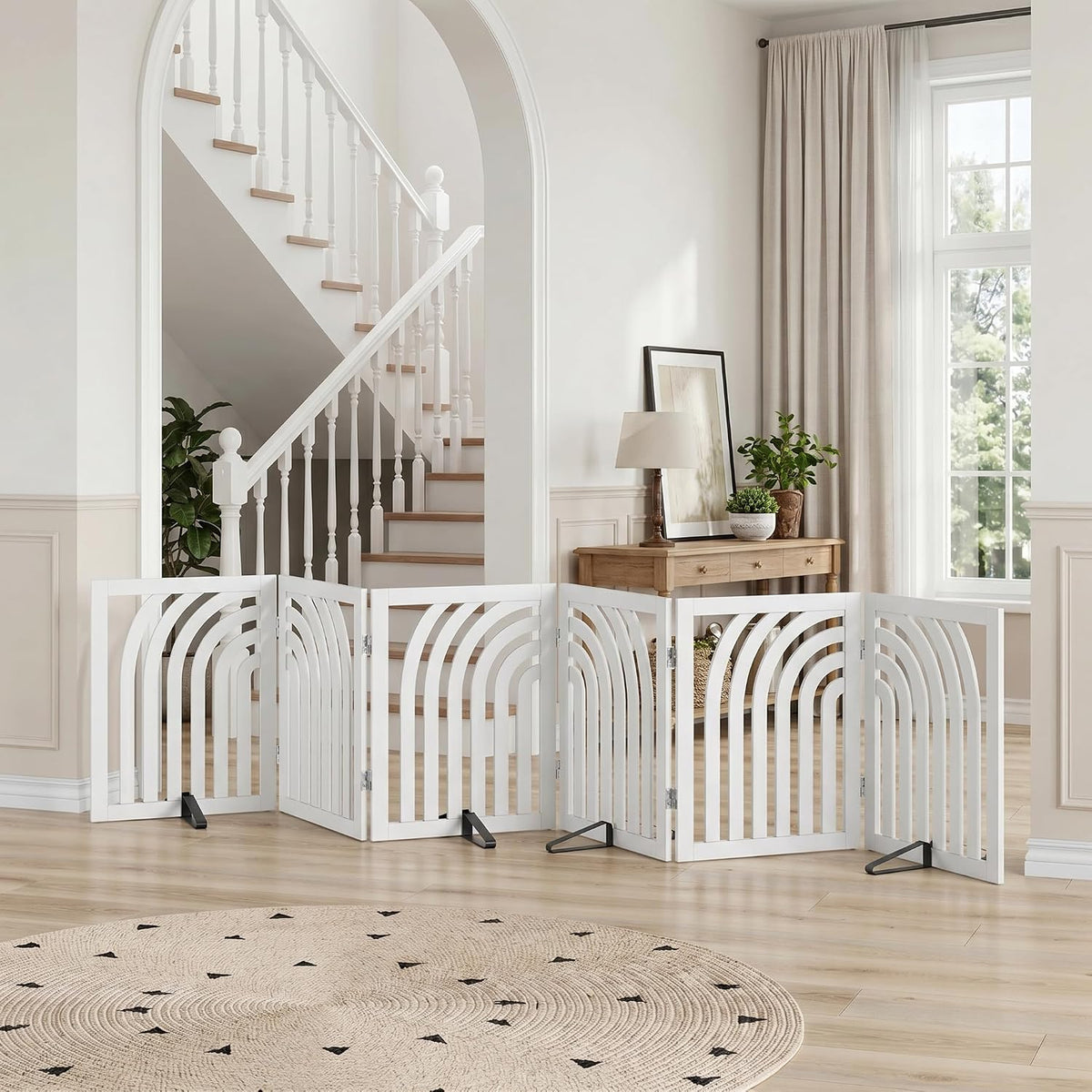 White curved six-panel freestanding dog gate with metal support feet