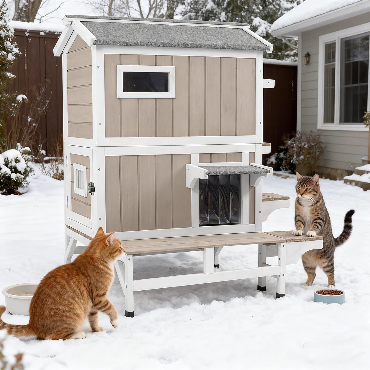 Grey two-story wooden outdoor cat house with escape doors