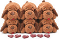 Six plush puppy toys with heartbeat inserts and heat packs laid out together