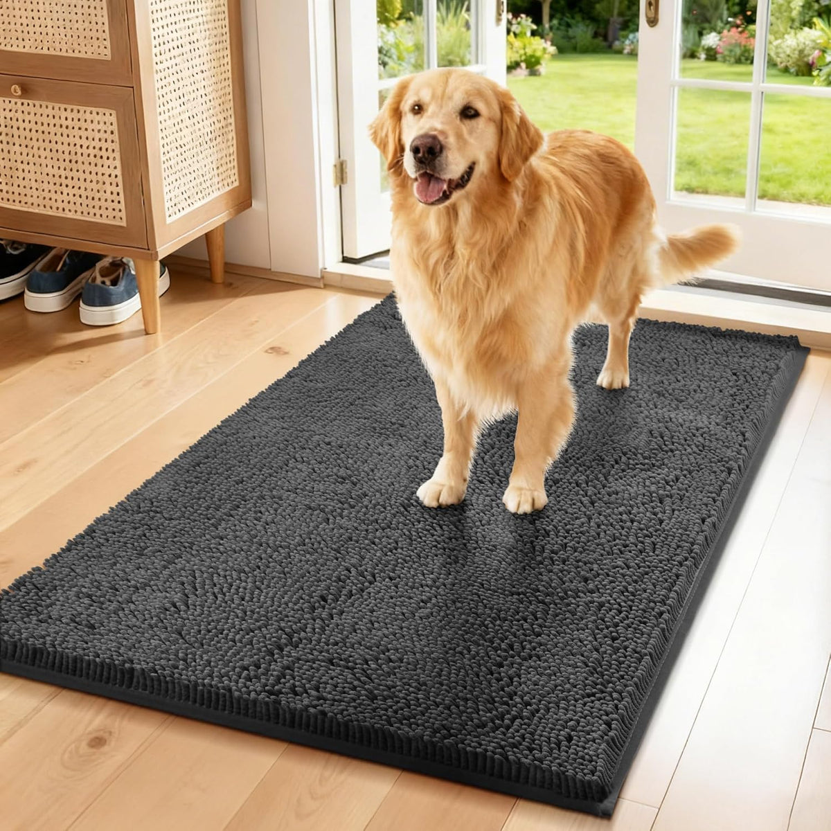 Long dark grey chenille runner mat with muddy paw prints near a front door