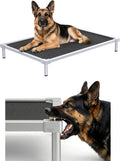 Grey elevated dog cot with silver aluminum frame on a porch