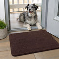 Brown small chenille dog door mat at a front entrance