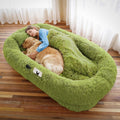 Grass green human-size faux fur nest bed with pillow and blanket