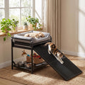 Raised pet sofa bed with pull-out ramp beside a human bed