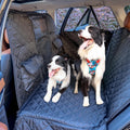 Hard bottom dog seat extender with mesh barrier covering a car rear seat