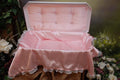 White pet burial casket with domed lid and pink interior, medium size