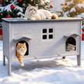Gray elevated plastic outdoor cat house with two doors