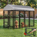Black heavy duty outdoor dog kennel run with roof cover in a backyard