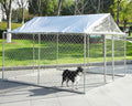 Galvanized welded wire outdoor dog kennel with waterproof top cover on a lawn
