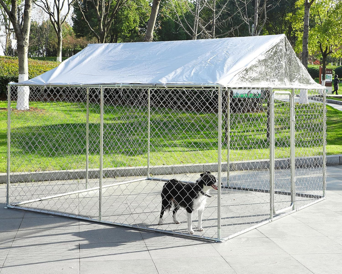 Galvanized welded wire outdoor dog kennel with waterproof top cover on a lawn
